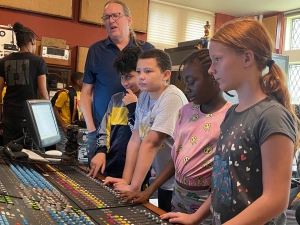 Teacher showing students how to use equipment